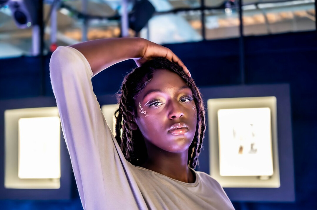 Portrait of a Black woman lighting designer smiling