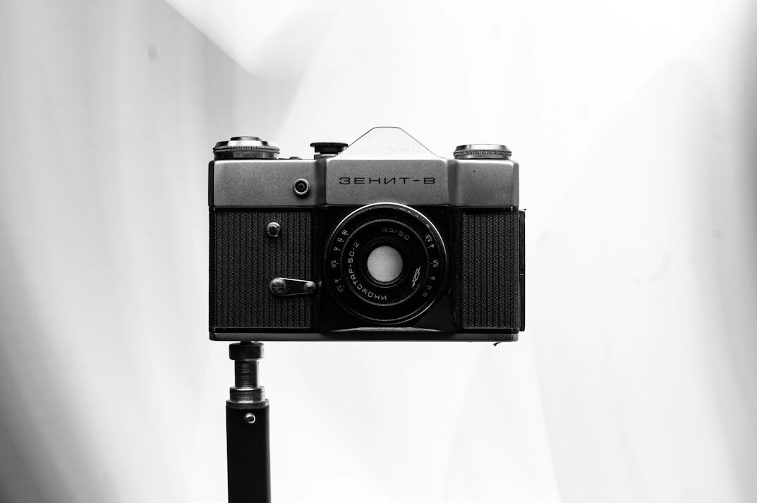 Professional broadcast camera on a pedestal in a television studio